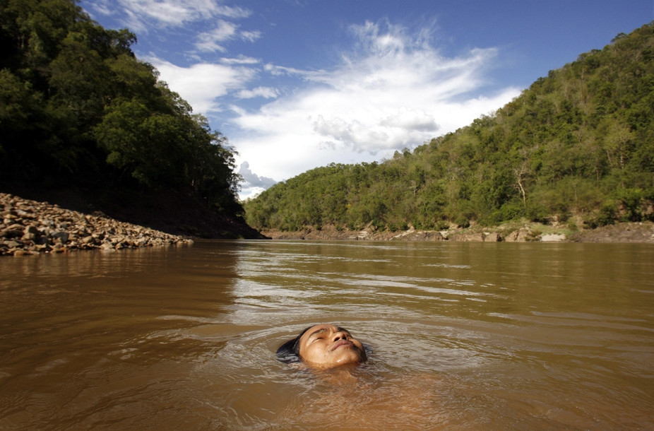 A 16-year-old Karen boy swims in the Salween River at the Myanmar-Thai border.