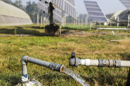 A farm with a solar water pump.