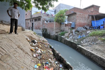 Polluted water flows towards the Ganges river, near Kanpurm India. 