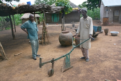 Abdullah demonstrates how he uses bullocks to power a hand guided plow when preparing his maize fields