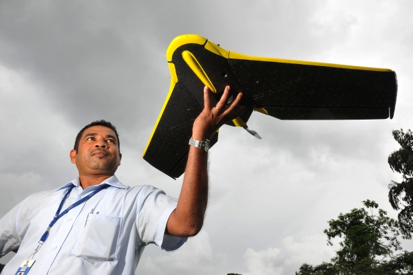 GIS specialist Ranjith Alankara with the IWMI drone for a test flight near Colombo, Sri Lanka-600