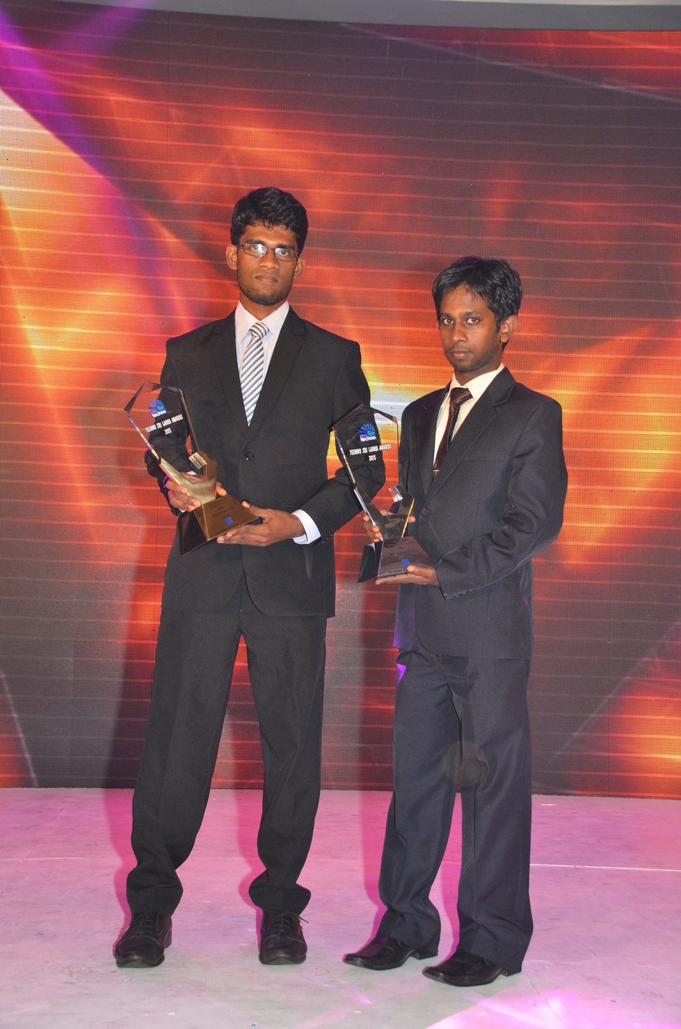Photo: Anuruddha (left) and Thilina (right) with the Gold and Silver Awards