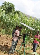 Farmer Godana charging mobile phones with the power generated by solar pump (Photo: Desalegne Tadesse)