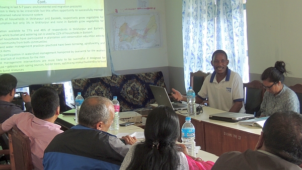 IWMI researchers Ambika Khadka and Romulus Okwany present and discuss their field data with the implementation unit