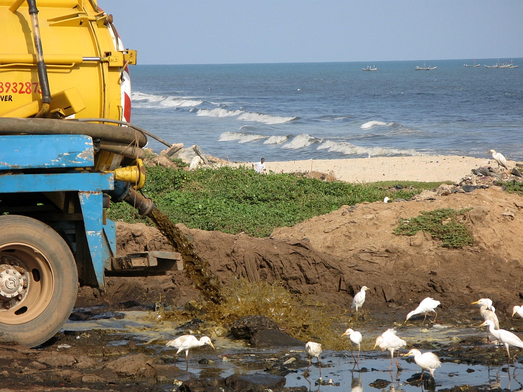 Truck discharging septic tank effluents on the coastal area in Accra, Ghana