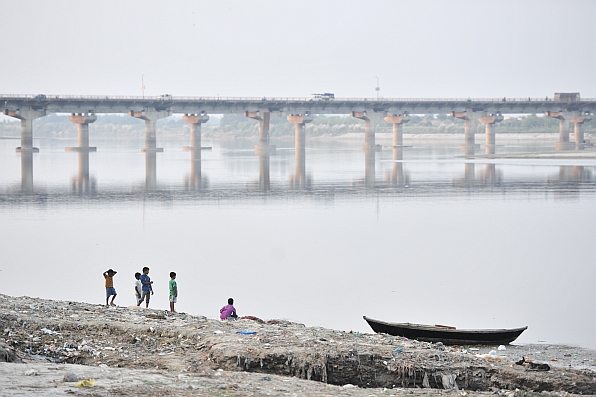 Children play by the Ganges river