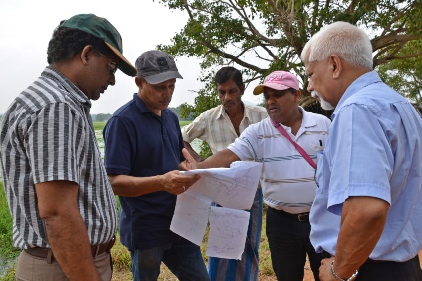 IWMI researchers conducting a field visit to a series of small reservoir sites in the Malwathu Oya River Basin