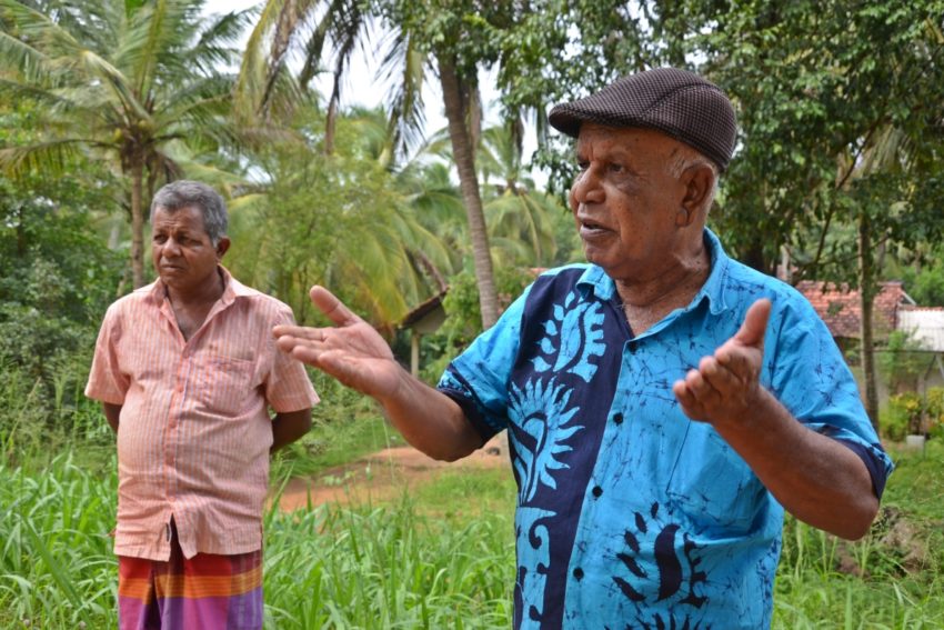 R. Kapuruhami (right), head of the farmers association at Selesthimaduwa in Anuradhapura District, North Central Province