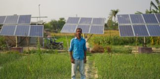 Farmer Yatin Kumar in front of his solar irrigation pump site. Photo: Metro Media / IWMI