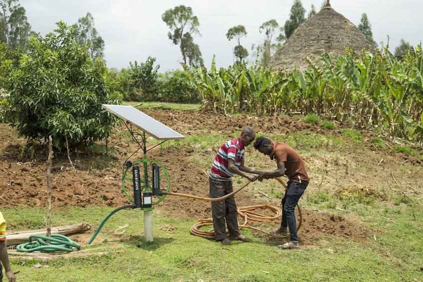Connecting a solar pump to pump groundwater. Photo: Maheder Haileselassie / IWMI