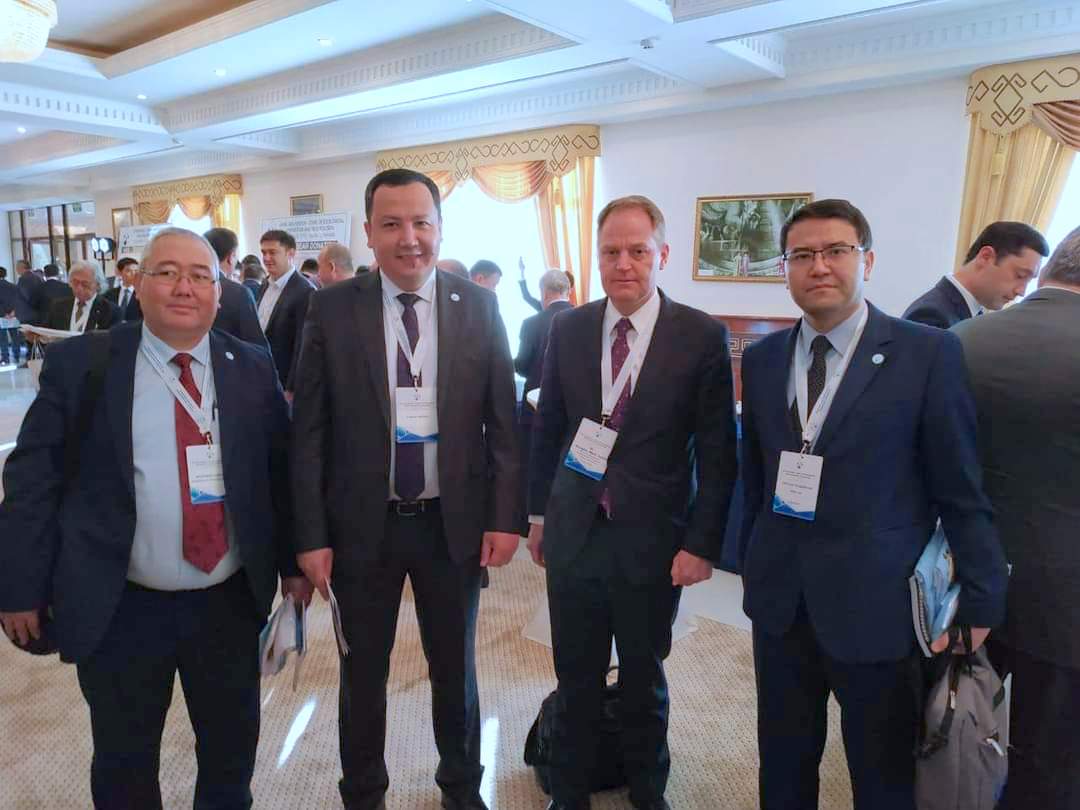 Kakhramon Djumaboev (first from left) with IWMI colleagues at a conference. Photo: Handout.