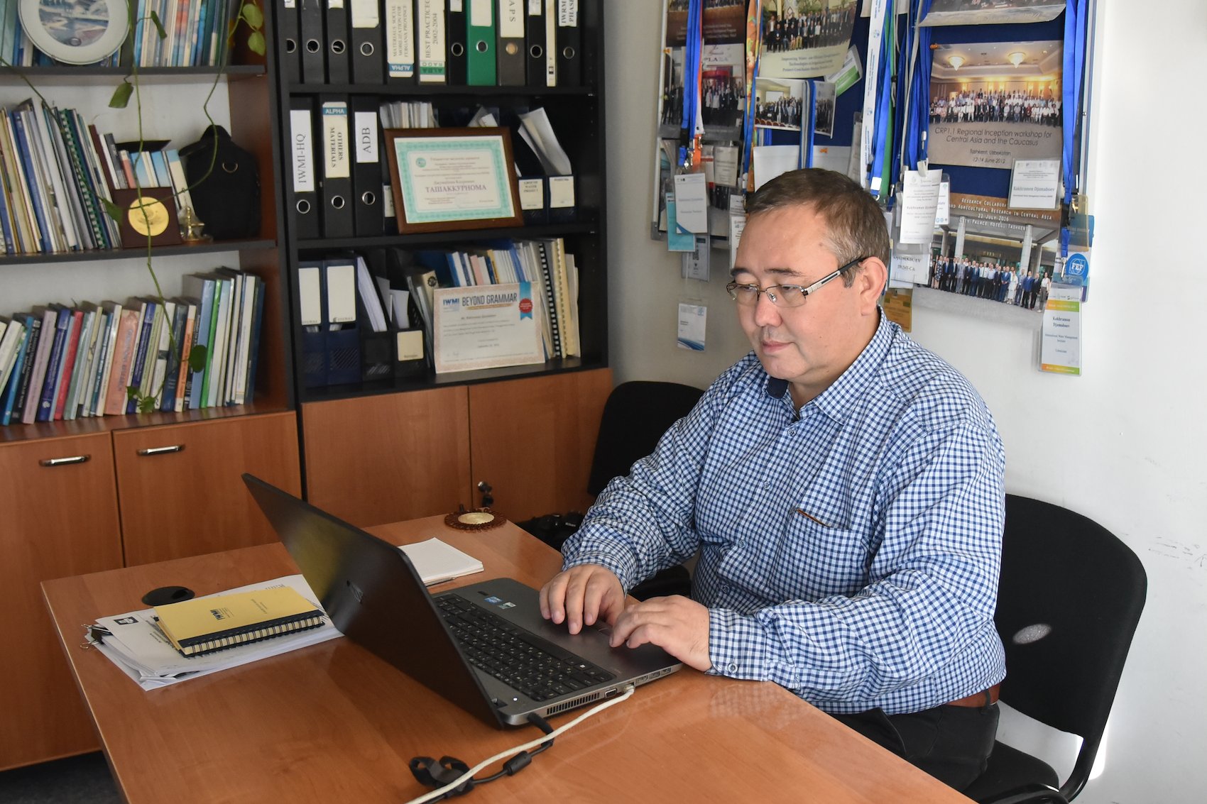 Kakhram Djumaboev at his office. Photo: Sanobar Khudaybergenova for USAID
